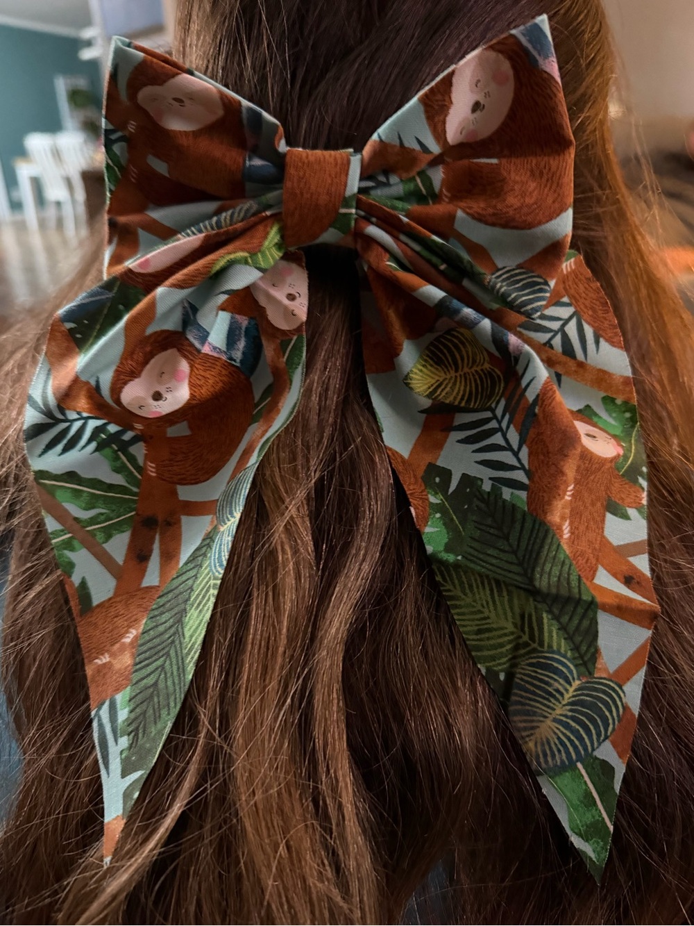 Playful Sloth Print Hair Bow in Teal and Brown